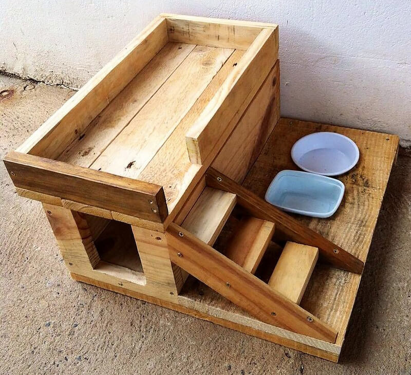 wood pallets dog house with food bowls